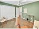 Bedroom featuring a ceiling fan, a large window, and neutral carpeting at 28 Torrens Pl., Pawleys Island, SC 29585