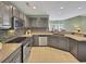 Well-appointed kitchen with granite countertops, stainless steel appliances, and a breakfast bar for casual dining at 28 Torrens Pl., Pawleys Island, SC 29585