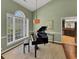 Living room with a piano, large window and trim at 28 Torrens Pl., Pawleys Island, SC 29585