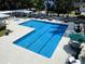 Community swimming pool featuring lap lanes, lounge chairs, and outdoor seating at 28 Torrens Pl., Pawleys Island, SC 29585
