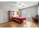 Bright bedroom with built in headboard storage, fan, and shuttered windows at 306 River Rock Ln. # 1306, Murrells Inlet, SC 29576