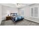 Bright bedroom with natural light, ceiling fan, and window shutters at 306 River Rock Ln. # 1306, Murrells Inlet, SC 29576