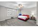 Spacious bedroom with ample natural light from the large windows with shutters at 306 River Rock Ln. # 1306, Murrells Inlet, SC 29576