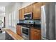Kitchen boasts granite countertops, stainless steel appliances, mosaic backsplash, and plenty of cabinet space at 306 River Rock Ln. # 1306, Murrells Inlet, SC 29576