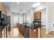 Spacious kitchen featuring a breakfast bar, granite counters, and stainless steel appliances at 306 River Rock Ln. # 1306, Murrells Inlet, SC 29576