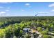 An aerial view showcasing the property's location near the lush trees and Cherry Grove Beach at 3107 Robyn Ct., Little River, SC 29566