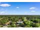 An aerial view of the property at 3107 Robyn Ct with lush greenery, trees, and a nearby water feature at 3107 Robyn Ct., Little River, SC 29566
