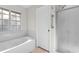 Bathroom featuring a shower, soaking tub, and window at 3107 Robyn Ct., Little River, SC 29566