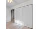 This bedroom features neutral carpet, a ceiling fan, and a large closet with bi-fold doors at 3107 Robyn Ct., Little River, SC 29566