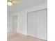 This bedroom features neutral carpet, a ceiling fan, and a large closet with bi-fold doors at 3107 Robyn Ct., Little River, SC 29566