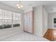 Bright kitchen nook area featuring white tiled flooring and windows providing ample natural light at 3107 Robyn Ct., Little River, SC 29566