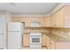 Bright kitchen featuring ample cabinetry, tiled backsplash, granite counters and modern appliances at 3107 Robyn Ct., Little River, SC 29566