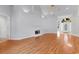 Bright living room featuring hardwood floors, fireplace, and an arched entryway at 3107 Robyn Ct., Little River, SC 29566