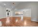 Spacious open-concept living area with hardwood floors flowing into kitchen and dining area at 3107 Robyn Ct., Little River, SC 29566