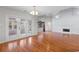 Open concept living room with hardwood floors, fireplace, and access to outdoor patio at 3107 Robyn Ct., Little River, SC 29566
