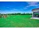 Expansive backyard with lush green grass and a swing set, ideal for outdoor activities and entertainment at 3148 Gause Rd., Loris, SC 29569