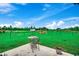 Spacious backyard featuring a patio with an outdoor table and chairs set with green grass at 3148 Gause Rd., Loris, SC 29569