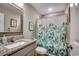 Bathroom featuring a granite countertop, framed mirror, and shower with floral curtain at 3148 Gause Rd., Loris, SC 29569