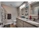 Bathroom with double sinks, granite countertops, and framed mirrors at 3148 Gause Rd., Loris, SC 29569