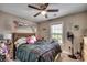 Cozy bedroom features a ceiling fan and a window providing natural light at 3148 Gause Rd., Loris, SC 29569