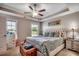 Primary bedroom featuring an upholstered headboard, ceiling fan, and matching nightstands at 3148 Gause Rd., Loris, SC 29569