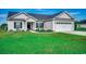 Charming one-story home features a two-car garage, landscaped front yard, and inviting entryway at 3148 Gause Rd., Loris, SC 29569