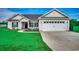 Charming one-story home features a two-car garage, landscaped front yard, and inviting entryway at 3148 Gause Rd., Loris, SC 29569