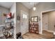 Inviting foyer with wood flooring and decorative shelving creates a warm welcome at 3148 Gause Rd., Loris, SC 29569