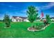 Charming single-Gathering home with a well-manicured lawn, mature trees, and an American flag at 3148 Gause Rd., Loris, SC 29569