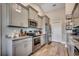 Modern kitchen with stainless steel appliances, granite countertops, and gray cabinetry at 3148 Gause Rd., Loris, SC 29569