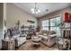 Comfortable living room featuring a vaulted ceiling, large window, and stylish furnishings at 3148 Gause Rd., Loris, SC 29569