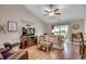 Open-concept living area boasts vaulted ceilings, a fireplace, and access to the outdoor space at 3148 Gause Rd., Loris, SC 29569