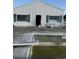 Exterior view of abandoned backyard featuring a swimming pool and a diving board at 3293 Schoolhouse Dr., Hemingway, SC 29554