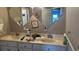 A bathroom featuring a double sink vanity and large mirrors, but in need of some cleaning and repairs at 3293 Schoolhouse Dr., Hemingway, SC 29554