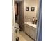 Cozy bathroom with white vanity and cabinets, perfect for a quick refresh at 3293 Schoolhouse Dr., Hemingway, SC 29554