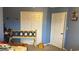 Bedroom with unfinished decor details, including a headboard and blue walls at 3293 Schoolhouse Dr., Hemingway, SC 29554