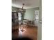 Cozy dining area with stainless steel refrigerator and a view of the backyard at 3293 Schoolhouse Dr., Hemingway, SC 29554