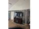 Spacious living room with wood paneling and a modern entertainment center with electric fireplace at 3293 Schoolhouse Dr., Hemingway, SC 29554