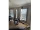 Cozy living room with natural light and peeling floor at 3293 Schoolhouse Dr., Hemingway, SC 29554