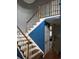 Bright foyer with wood staircase, white railing and banister with blue accent wall at 3293 Schoolhouse Dr., Hemingway, SC 29554