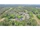 This aerial view shows neighborhood streets surrounded by lush landscapes and golf course at 33 Brassie Dr., Carolina Shores, NC 28467
