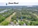 Stunning aerial view shows the community's lush landscaping and proximity to Sunset Beach at 33 Brassie Dr., Carolina Shores, NC 28467