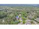 An aerial view showcases neighborhood streets surrounded by trees and beautiful landscaping at 33 Brassie Dr., Carolina Shores, NC 28467