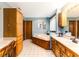 Light and bright bathroom features a soaking tub, vanity, and wood cabinets at 33 Brassie Dr., Carolina Shores, NC 28467
