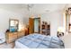 Bright bedroom with a bed, ceiling fan, and dresser at 33 Brassie Dr., Carolina Shores, NC 28467