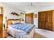 Cozy bedroom with a bed, ceiling fan, and wood closet doors at 33 Brassie Dr., Carolina Shores, NC 28467