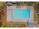 Aerial view shows an expansive pool with plenty of room to swim and a separate kid pool at 33 Brassie Dr., Carolina Shores, NC 28467