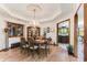 Elegant dining room features a decorative ceiling, chandelier, and view of kitchen at 33 Brassie Dr., Carolina Shores, NC 28467