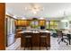 Bright kitchen with island, stainless steel appliances, and a breakfast nook perfect for casual dining at 33 Brassie Dr., Carolina Shores, NC 28467