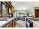 Charming kitchen with stainless steel appliances, granite countertops, and a cozy dining area at 33 Brassie Dr., Carolina Shores, NC 28467